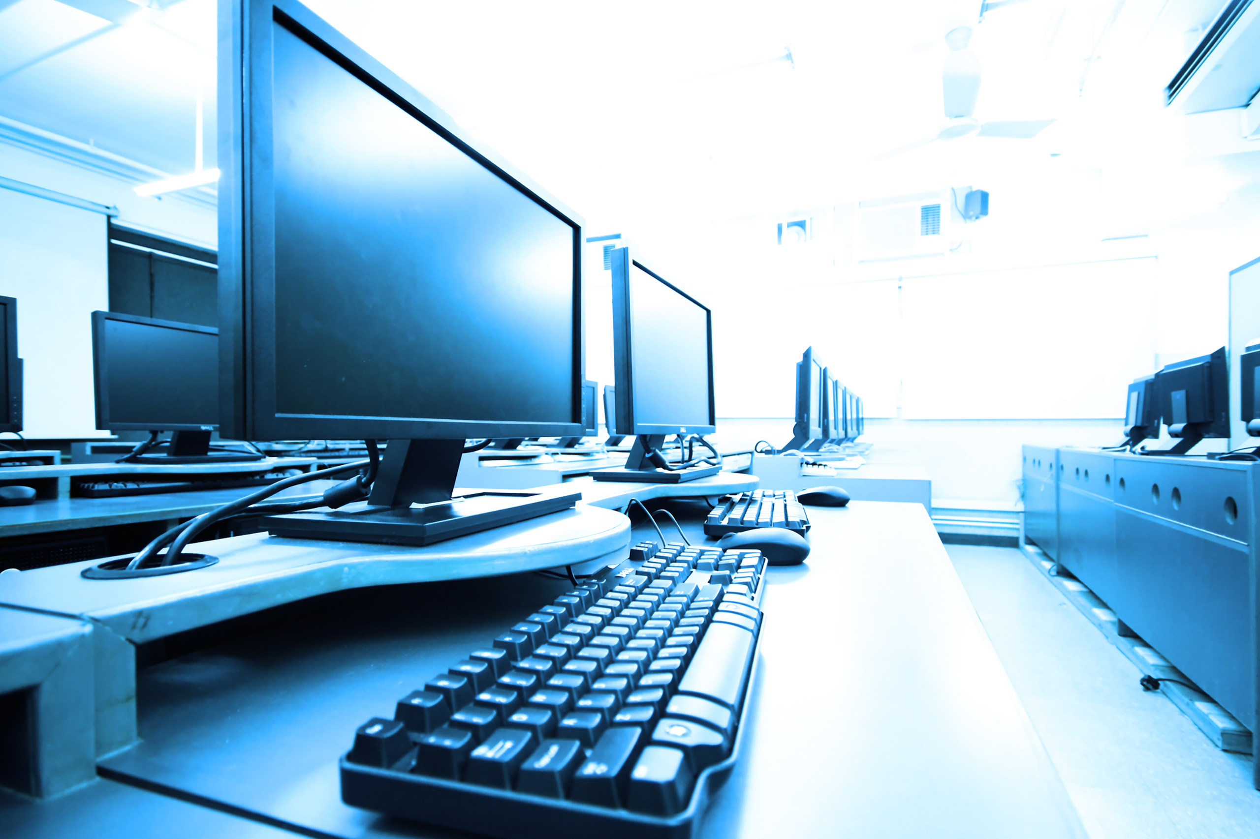 workplace room with computers in row