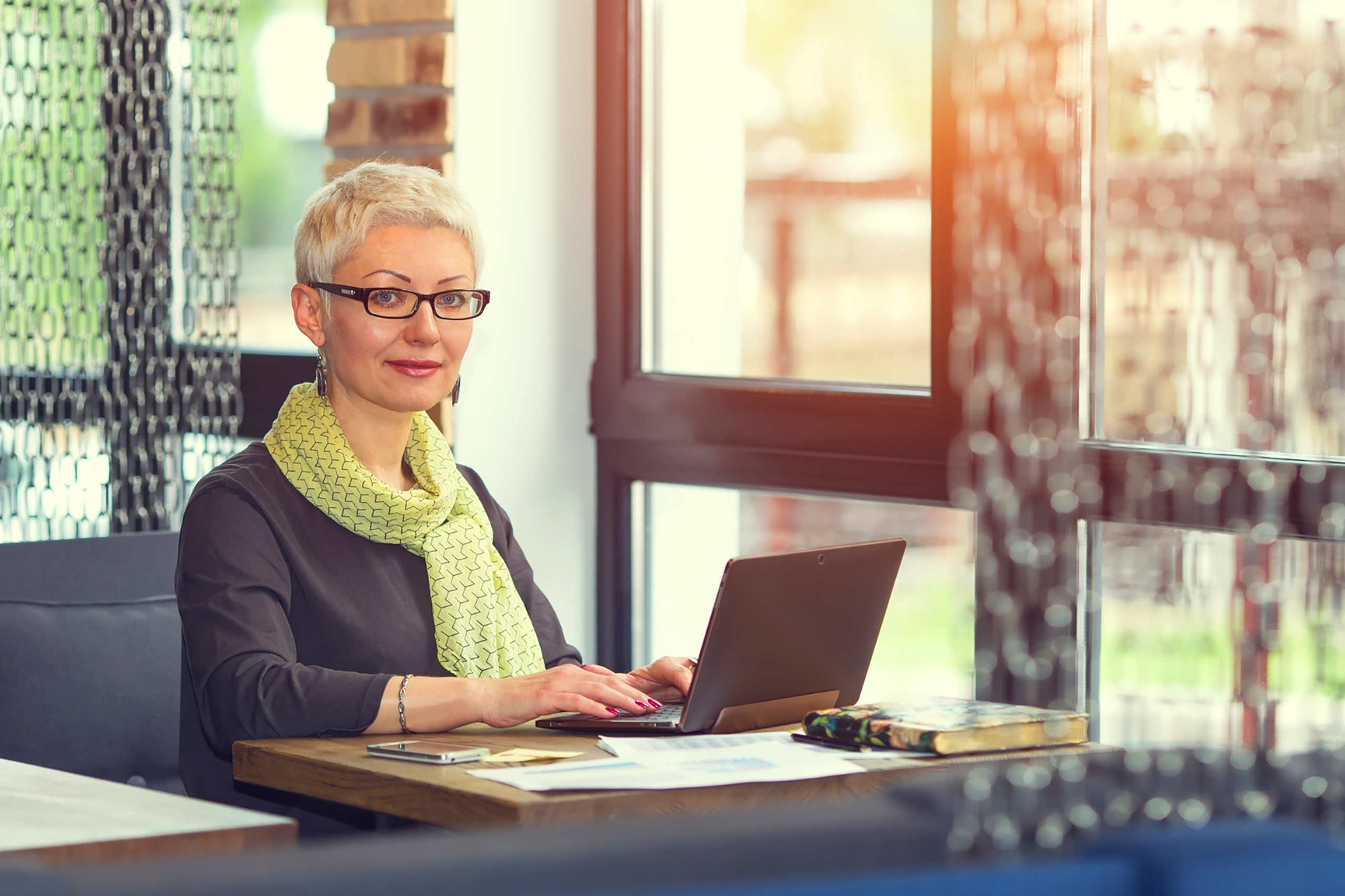 Senior professional woman on computer at desk
